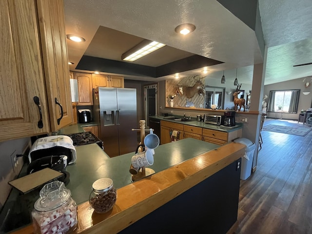34722 36th Ave, Paw Paw, MI 49079 - kitchen with a peninsula, stainless steel refrigerator with ice dispenser, dark wood-type flooring, dishwasher, and range with gas stovetop