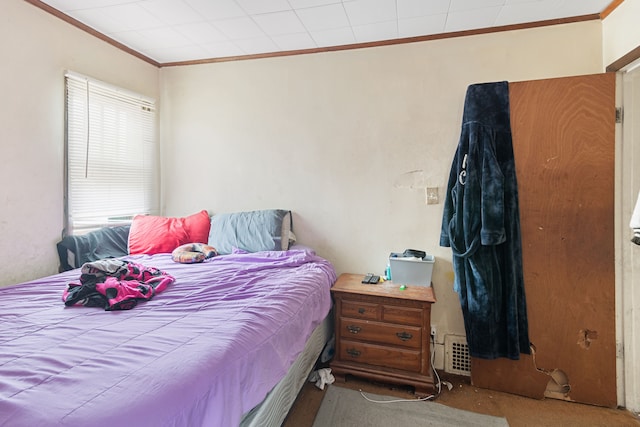 carpeted bedroom with crown molding and multiple windows