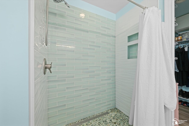 bathroom featuring a shower stall