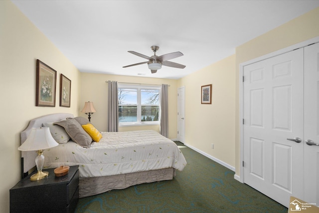 bedroom with dark carpet, baseboards, and a ceiling fan