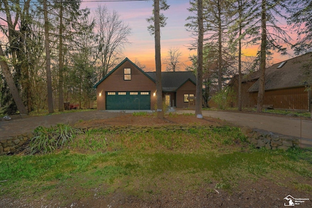 view of front of home with a garage and driveway