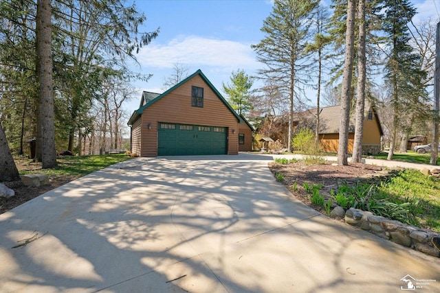 view of home's exterior with concrete driveway