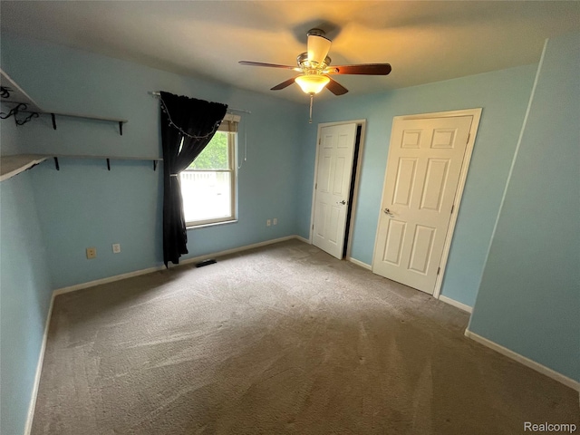 5652 N Lake Dr, Kimball, MI 48074 - unfurnished bedroom featuring carpet, ceiling fan, and baseboards