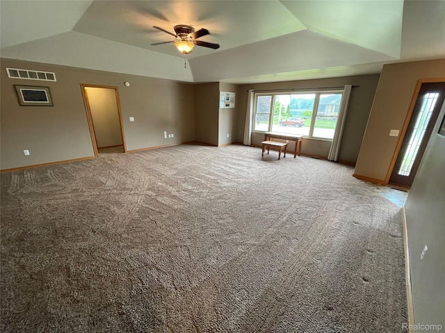 5652 N Lake Dr, Kimball, MI 48074 - empty room with lofted ceiling, ceiling fan, light carpet, baseboards, and a raised ceiling