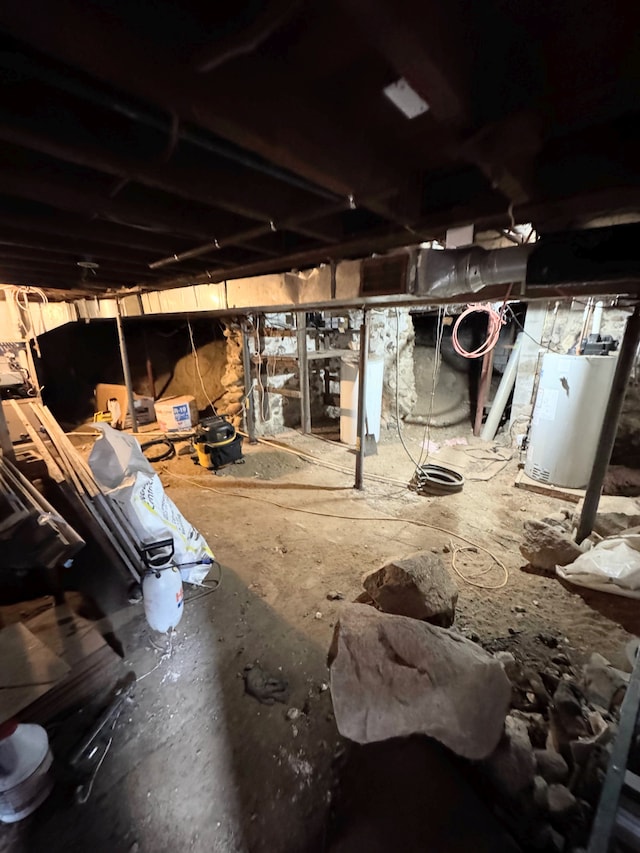 8083 S State Rd, Goodrich, MI 48438 - unfinished basement featuring water heater