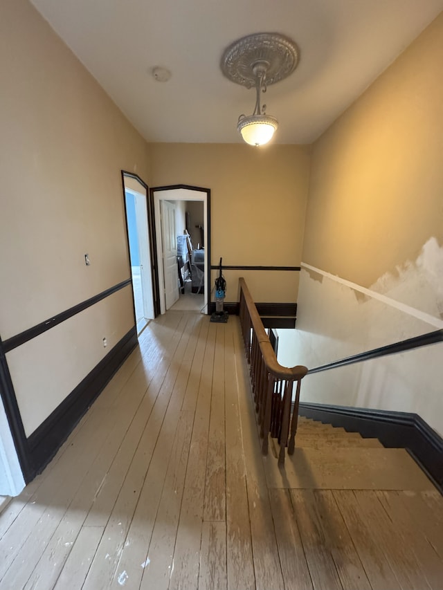 8083 S State Rd, Goodrich, MI 48438 - staircase featuring wood-type flooring and baseboards