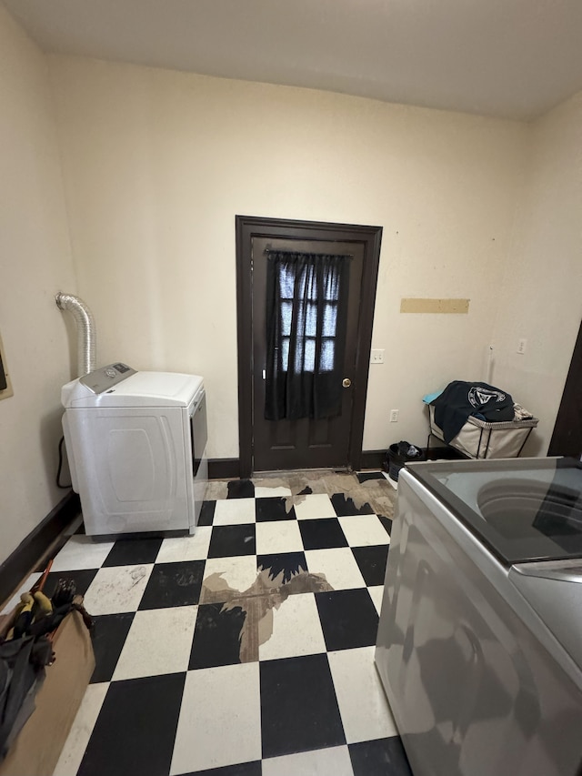 8083 S State Rd, Goodrich, MI 48438 - washroom featuring tile patterned floors, washing machine and dryer, and baseboards