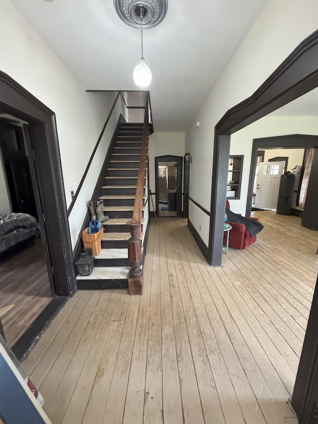 8083 S State Rd, Goodrich, MI 48438 - staircase with wood-type flooring and baseboards