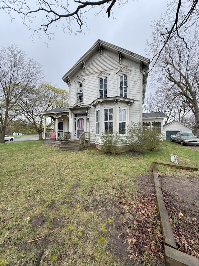 8083 S State Rd, Goodrich, MI 48438 - italianate house with a front yard and a porch