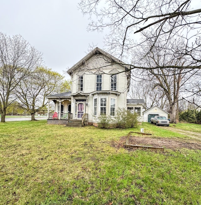 8083 S State Rd, Goodrich, MI 48438 - view of front facade featuring covered porch and a front yard