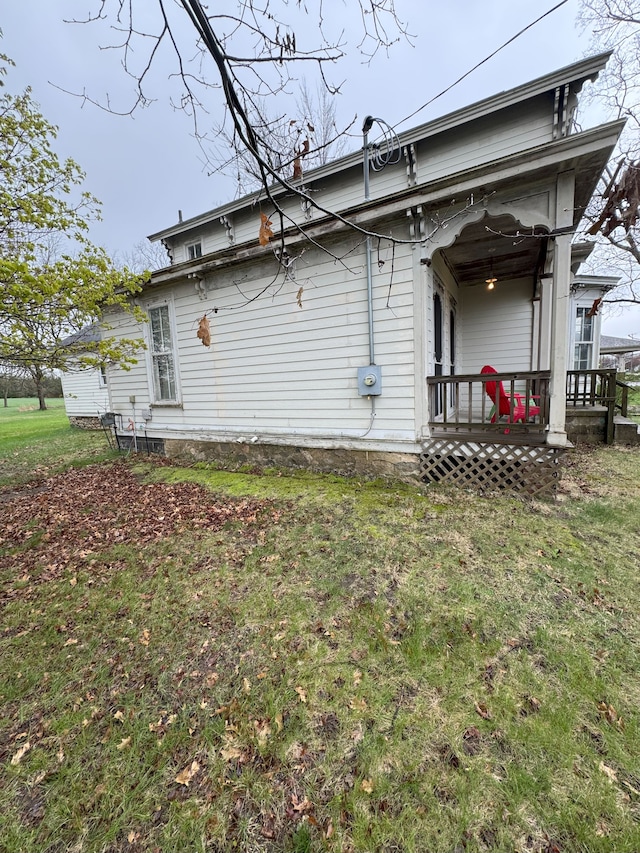8083 S State Rd, Goodrich, MI 48438 - view of property exterior with a lawn