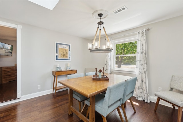 2510 Ruth Dr, Fenton, MI 48430 - dining area featuring dark wood-style flooring, baseboards, and a chandelier