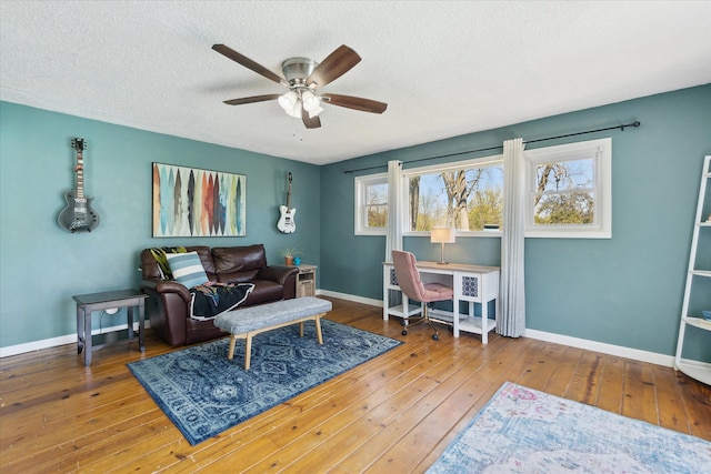 2510 Ruth Dr, Fenton, MI 48430 - living area with ceiling fan, hardwood / wood-style flooring, a textured ceiling, and baseboards