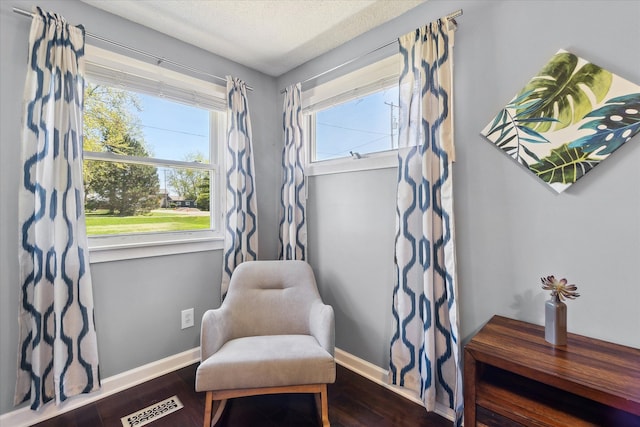 2510 Ruth Dr, Fenton, MI 48430 - sitting room featuring baseboards, wood finished floors, and a textured ceiling