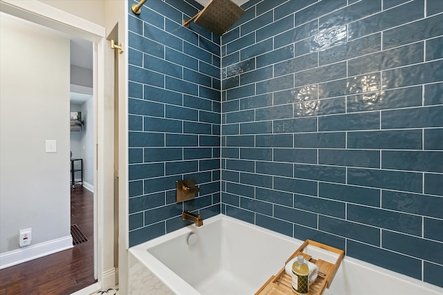 2510 Ruth Dr, Fenton, MI 48430 - bathroom with baseboards, shower / bathtub combination, and wood finished floors