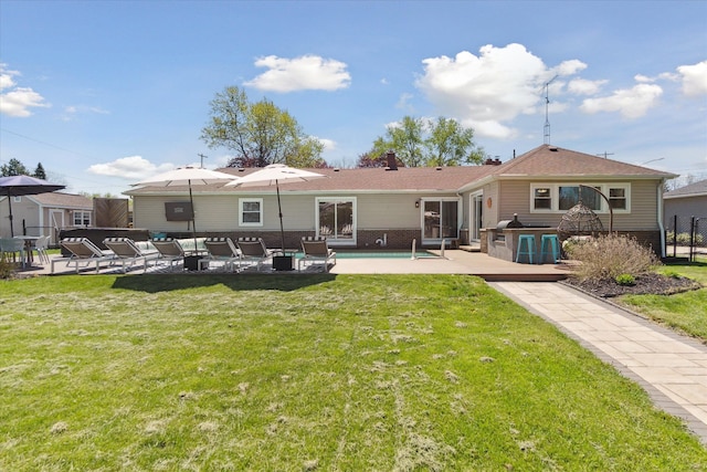 2510 Ruth Dr, Fenton, MI 48430 - back of house with a patio, an outdoor hangout area, an outdoor pool, brick siding, and a chimney