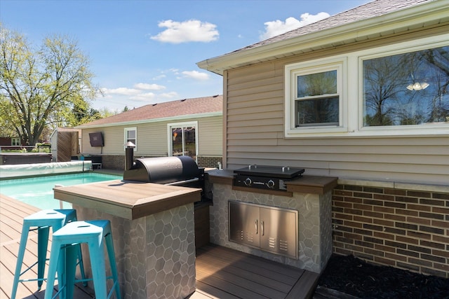 2510 Ruth Dr, Fenton, MI 48430 - wooden deck featuring area for grilling and a covered pool