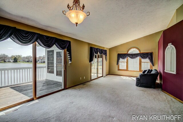 3076 Regency Pkwy, Zeeland, MI 49464 - living area featuring baseboards, carpet floors, visible vents, and a textured ceiling