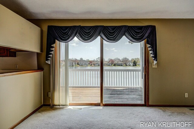 3076 Regency Pkwy, Zeeland, MI 49464 - interior space featuring baseboards, a water view, and carpet