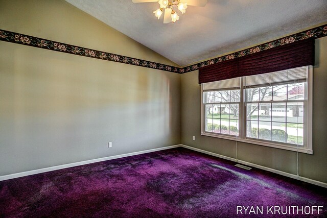 3076 Regency Pkwy, Zeeland, MI 49464 - unfurnished room with dark carpet, ceiling fan, lofted ceiling, and baseboards