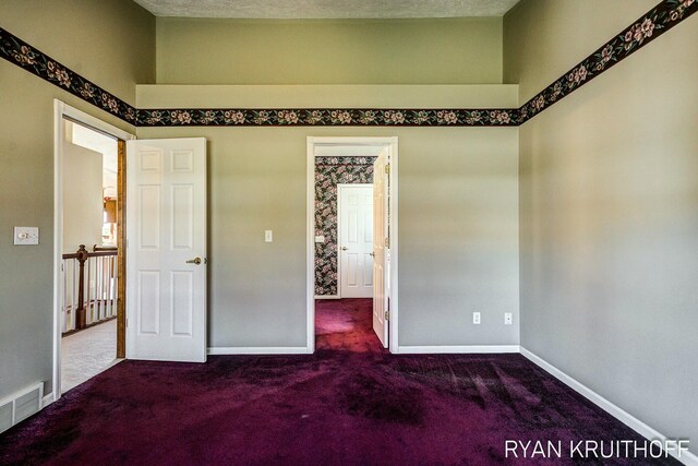 3076 Regency Pkwy, Zeeland, MI 49464 - unfurnished bedroom with baseboards, visible vents, and carpet
