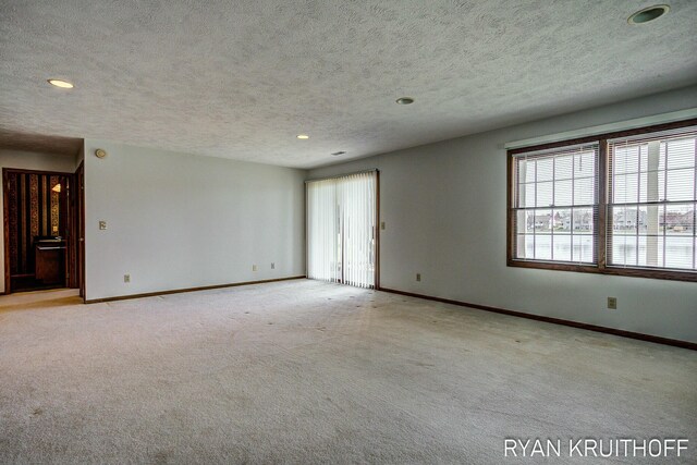 3076 Regency Pkwy, Zeeland, MI 49464 - empty room with recessed lighting, a healthy amount of sunlight, and baseboards