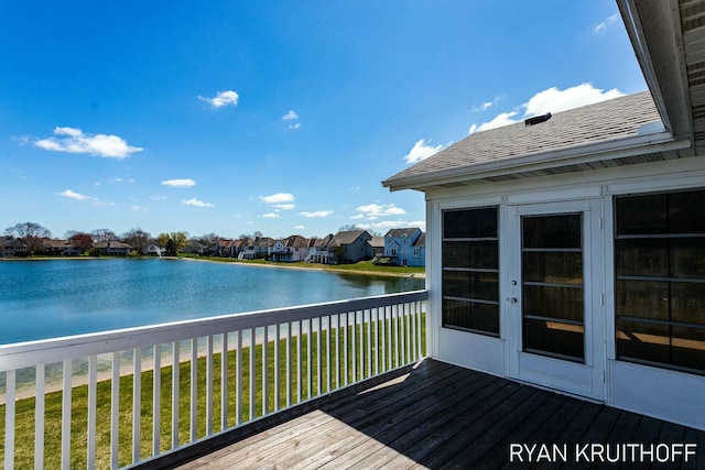 3076 Regency Pkwy, Zeeland, MI 49464 - wooden terrace with a lawn, a water view, and a residential view