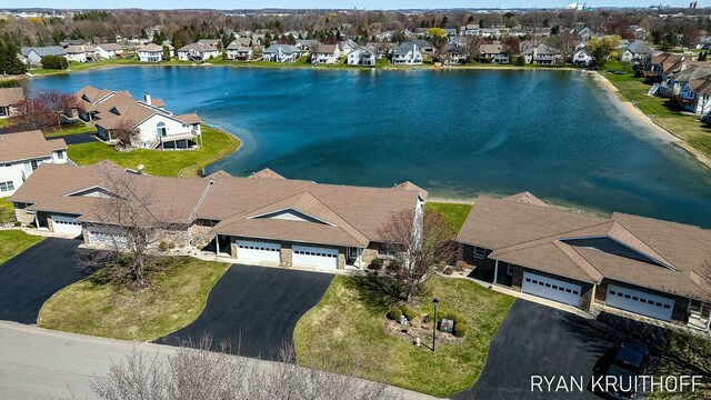 3076 Regency Pkwy, Zeeland, MI 49464 - drone / aerial view with a residential view and a water view