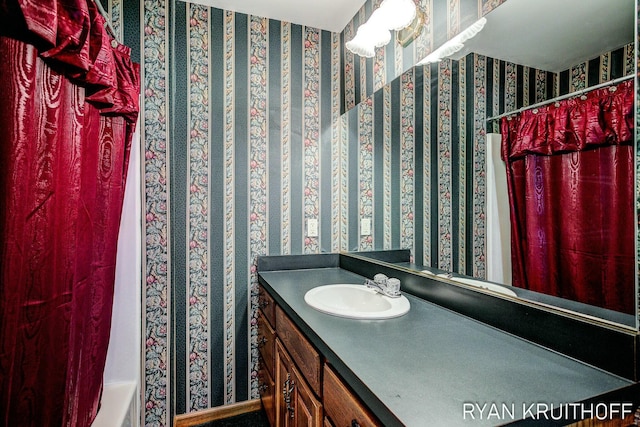 3076 Regency Pkwy, Zeeland, MI 49464 - full bath featuring vanity and wallpapered walls