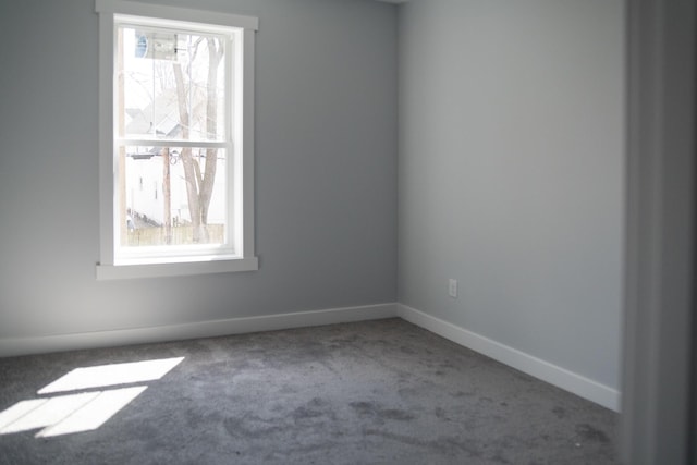 1024 Clinton Ave, Kalamazoo, MI 49001 - unfurnished room with baseboards and carpet