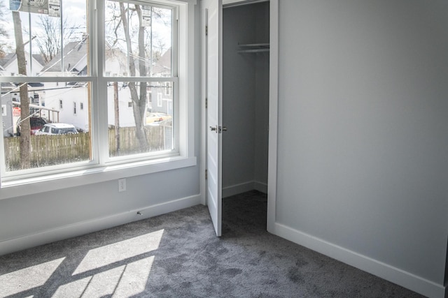 1024 Clinton Ave, Kalamazoo, MI 49001 - unfurnished bedroom with baseboards, carpet flooring, and a closet