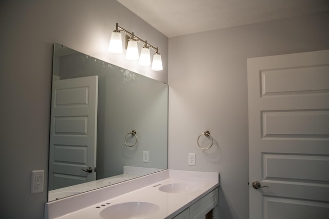 1024 Clinton Ave, Kalamazoo, MI 49001 - bathroom featuring double vanity and a sink