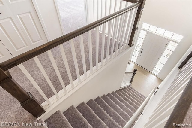 staircase with a high ceiling