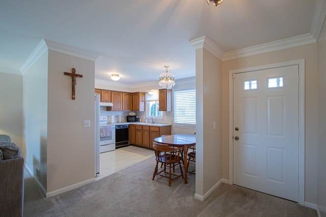 foyer entrance featuring light colored carpet, baseboards, ornamental molding, and an inviting chandelier