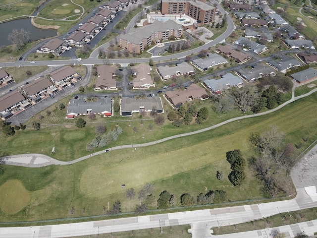 bird's eye view featuring view of golf course and a water view