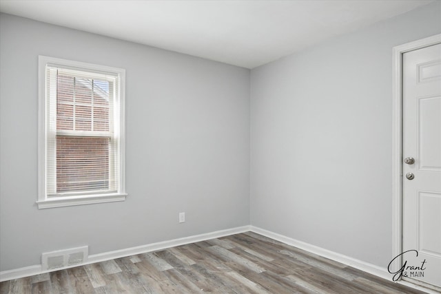 19931 Braile St, Detroit, MI 48219 - empty room with baseboards, wood finished floors, and visible vents
