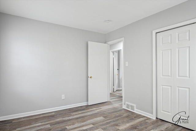 19931 Braile St, Detroit, MI 48219 - unfurnished bedroom with baseboards, wood finished floors, and visible vents