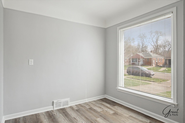 19931 Braile St, Detroit, MI 48219 - unfurnished room featuring baseboards, wood finished floors, and visible vents
