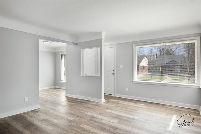 19931 Braile St, Detroit, MI 48219 - unfurnished living room with light wood finished floors and baseboards