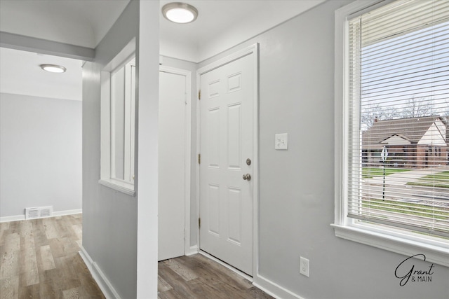 19931 Braile St, Detroit, MI 48219 - entryway with baseboards, wood finished floors, and visible vents
