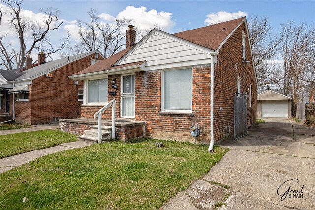 19931 Braile St, Detroit, MI 48219 - bungalow-style house with a detached garage, a chimney, an outdoor structure, a front yard, and brick siding
