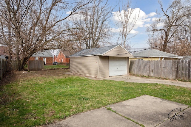 19931 Braile St, Detroit, MI 48219 - view of yard featuring an outdoor structure, driveway, fence, and a garage