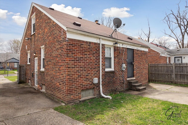 19931 Braile St, Detroit, MI 48219 - back of property with brick siding, fence, and entry steps