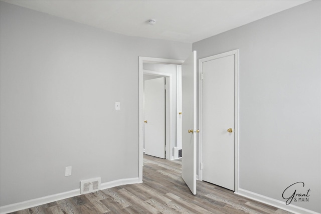 19931 Braile St, Detroit, MI 48219 - spare room featuring baseboards, light wood finished floors, and visible vents