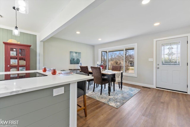 dining space featuring visible vents, baseboards, recessed lighting, and dark wood-type flooring