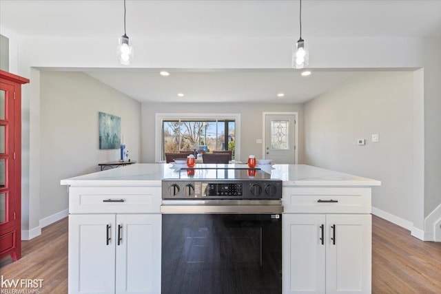 kitchen with baseboards, range with electric cooktop, white cabinetry, and light stone counters