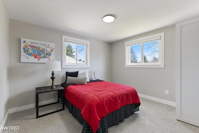 carpeted bedroom with baseboards