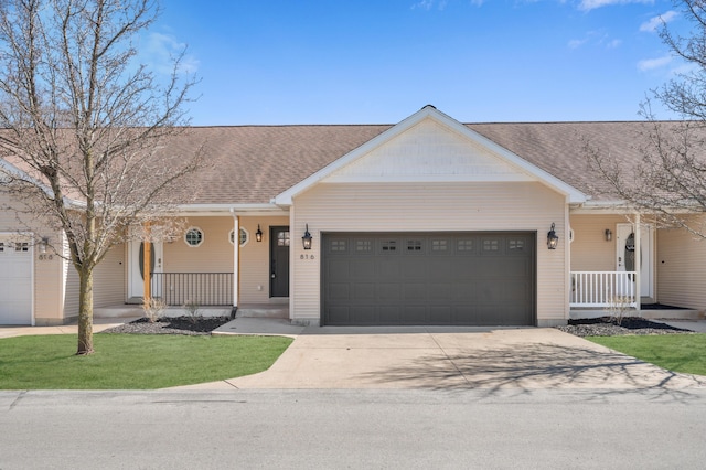 816 Tioga Park, Big Rapids, MI 49307 - ranch-style home with an attached garage, a porch, and concrete driveway
