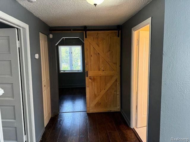 70 E Rockwood St, Ecorse, MI 48229 - corridor featuring dark wood-style flooring and a textured ceiling