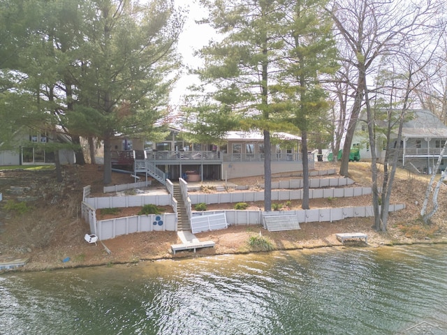 7841 Peninsular Dr, Farwell, MI 48622 - exterior space with fence and a deck with water view